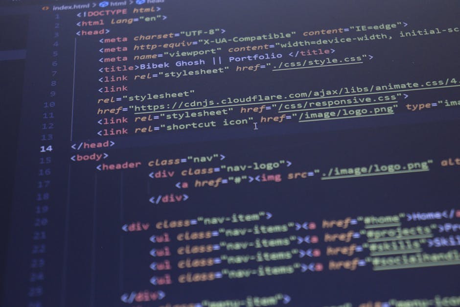 Close-up of a computer screen displaying colorful lines of programming code with syntax highlighting in various shades including red, green, blue, and yellow. The text appears sharp and vibrant, with 